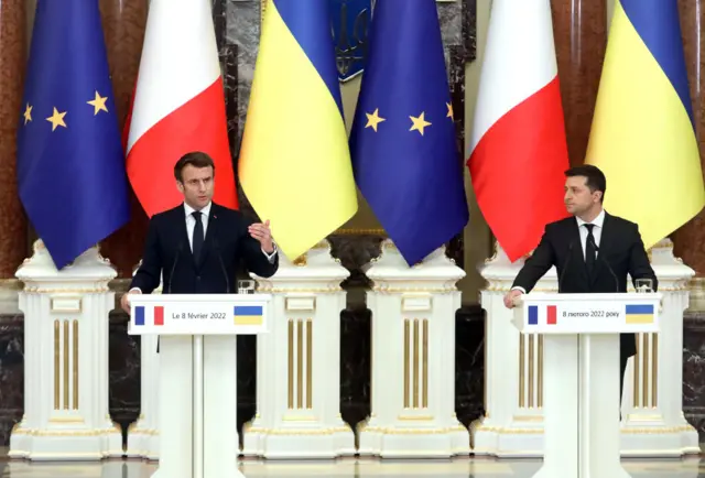 Emmanuel Macron (left) and Volodymyr Zelensky (right) are pictured together in Kyiv before the war