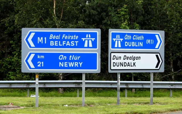 Road signs for Belfast and Dublin