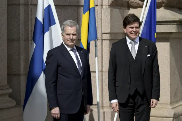 Finland's President Sauli Niinisto and Sweden's Speaker of the Parliament Andreas Norlen pose for a picture outside the parliament building in Stockholm