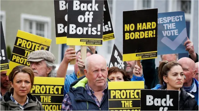 People holding protest placards