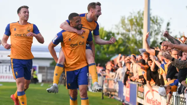 Mansfield players celebrate