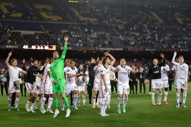 Eintracht Frankfurt players celebrate a famous victory at the Nou Camp