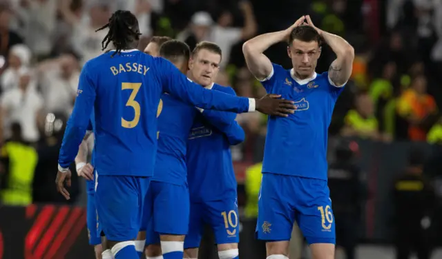 Players console Aaron Ramsey (right) at the end of the penalty shootout