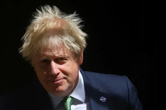 Boris Johnson leaves Downing Street to take questions in parliament, in London, Britain May 18, 2022