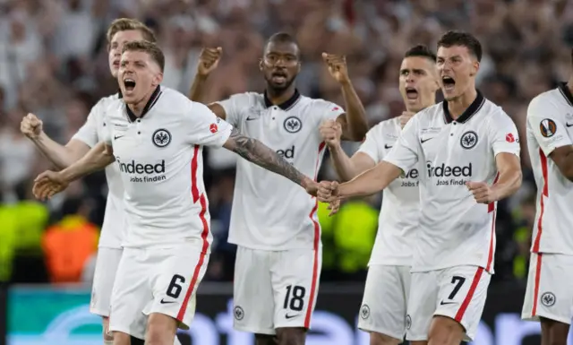 Eintracht Frankfurt players celebrate after Aaron Ramsey's penalty miss