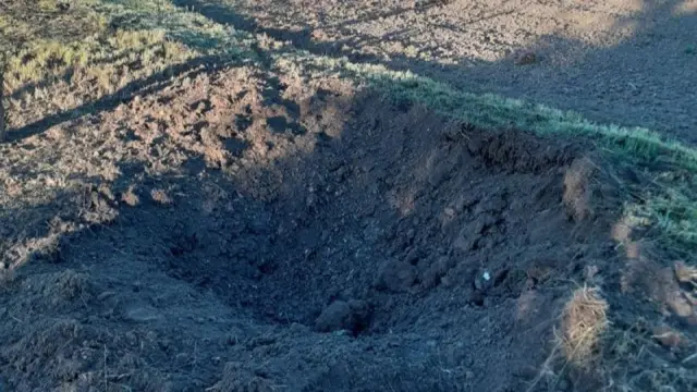 Shell crater in the ground