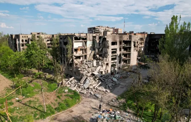 A view shows residential buildings destroyed in the southern port city of Mariupol