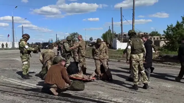 A screen grab from a Russian defence ministry video showing Ukrainian soldiers from Azovstal steel plantsurrendering on 17 May