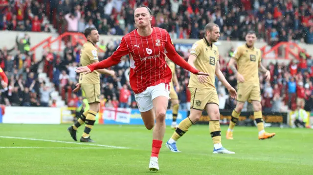 Harry McKirdy celebrates his goal for Swindon against Port Vale