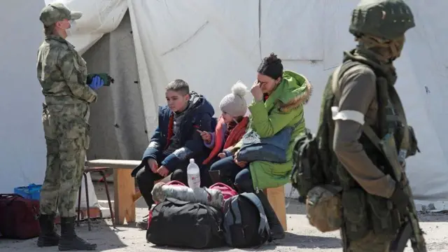 Evacuees at Russia's Bezimenne camp just east of Mariupol, 1 May 2022