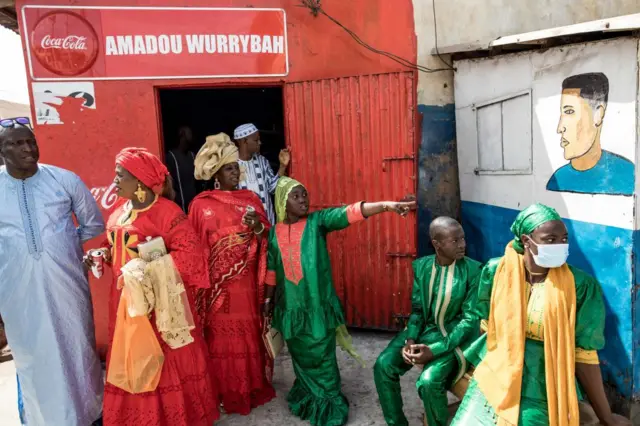 Worshippers arrive ahead of Eid al-Fitr prayers, marking the end of the Holy month of Ramadan, at the King Fahad Mosque in Banjul on May 2, 2022.