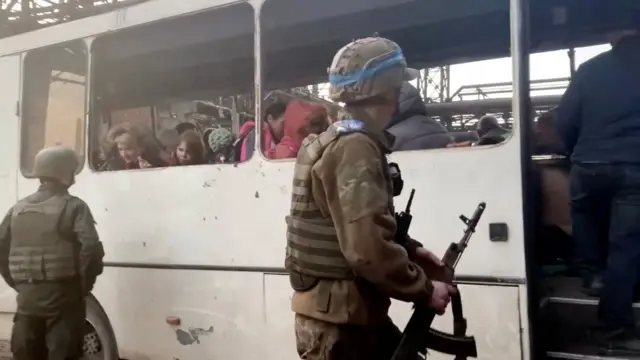 Civilians being evacuated on a bus