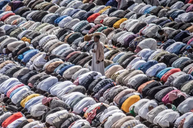 Muslim worshippers pray during the Eid al-Fitr morning prayer sermon at a soccer stadium in Addis Ababa, Ethiopia, on May 2, 2022 as Muslims across the globe mark the end of the Holy month of Ramadan.