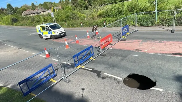 Sinkhole and road closure