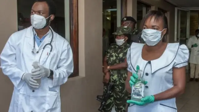 Health officials wearing face masks in Blantyre, Malawi