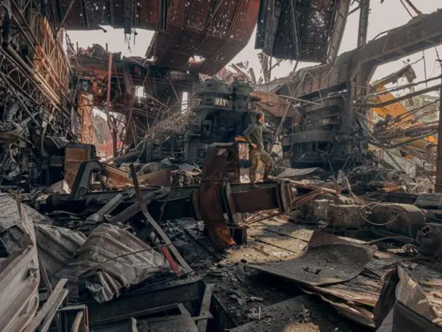 A man standing in the devastated Azovstal steelworks