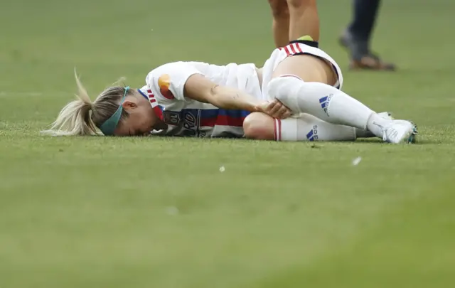 Ellie Carpenter is lying on the ground injured