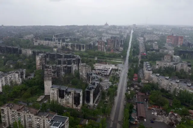 Aerial view of a charred cityscape in Mariupol