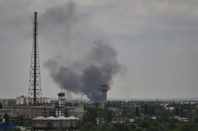 Smoke rises above rooftops in Severodonetsk