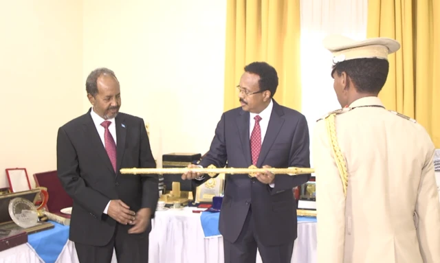 Mohamed Abdullahi "Farmajo" (R) and Hassan Sheikh Mohamud (L).