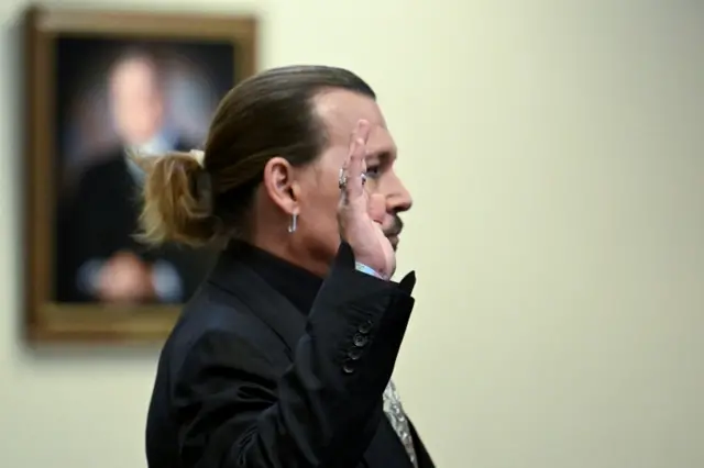 Johnny Depp takes the witness oath