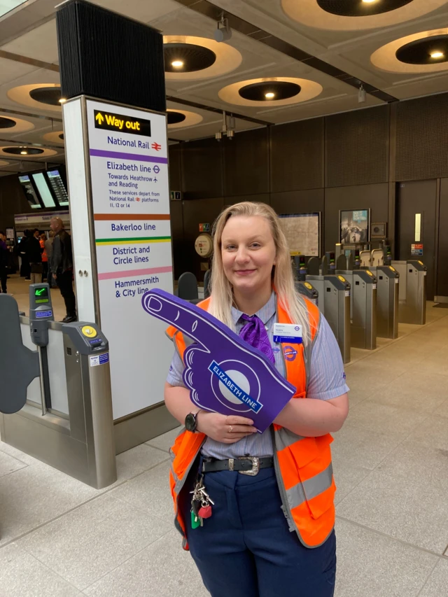 Transport worker at Paddington with Purple finger