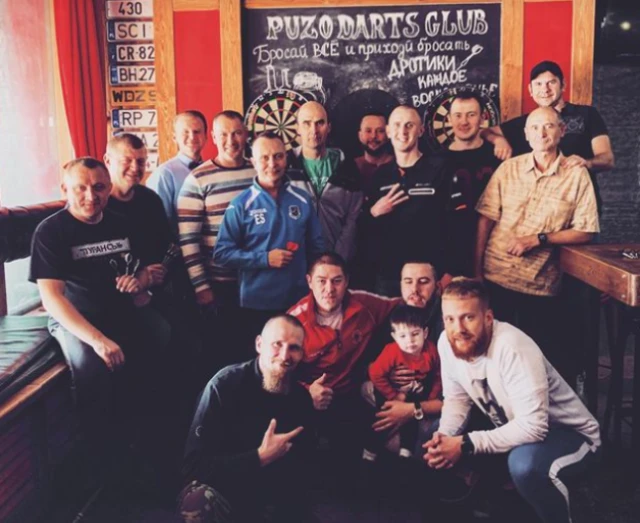 Dmytro Gabsaliamov, front right, and his pub's darts team