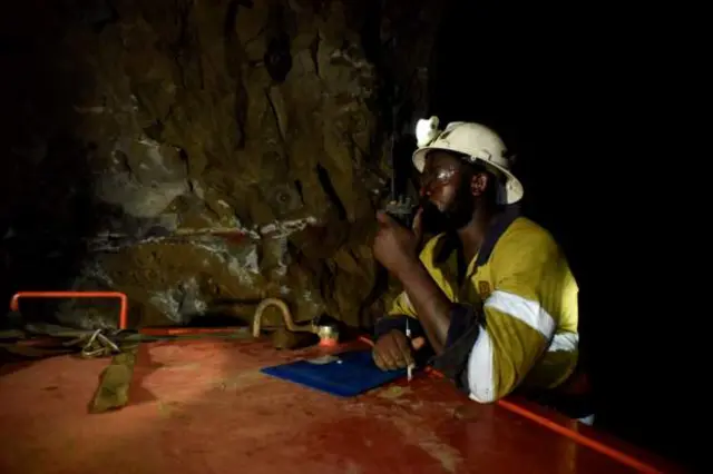 A man works during a rescue operation inside Perkoa mine where water is still being pumped out, four weeks after a flood trapped eight miners in Perkoa, Burkina Faso, 13 May 2022