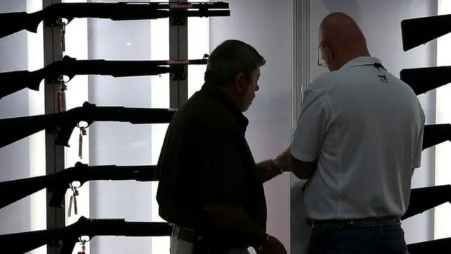 A display of shotguns at the NRA's annual convention in 2013