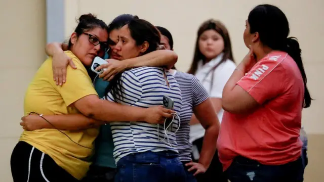 Relatives of children at the school gathered at a nearby civic centre to wait for news