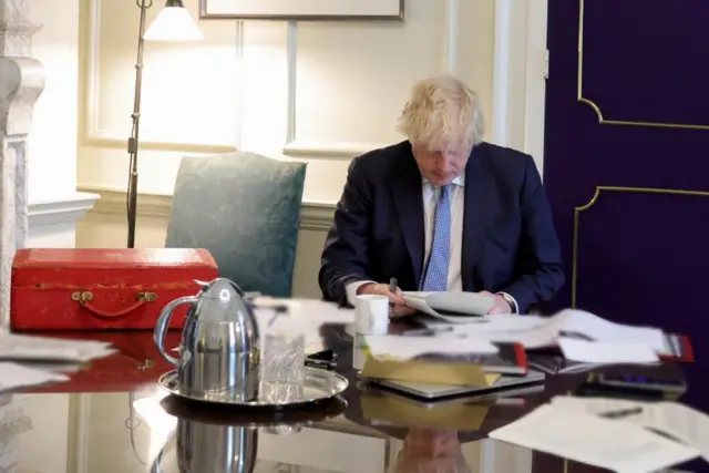 Boris Johnson reading Sue Gray's report