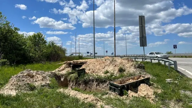 A roadside in Ukraine where bodies appear to have been dug up