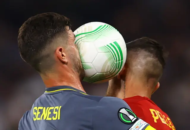 Feyenoord's Marcos Senesi in action with AS Roma's Lorenzo Pellegrini