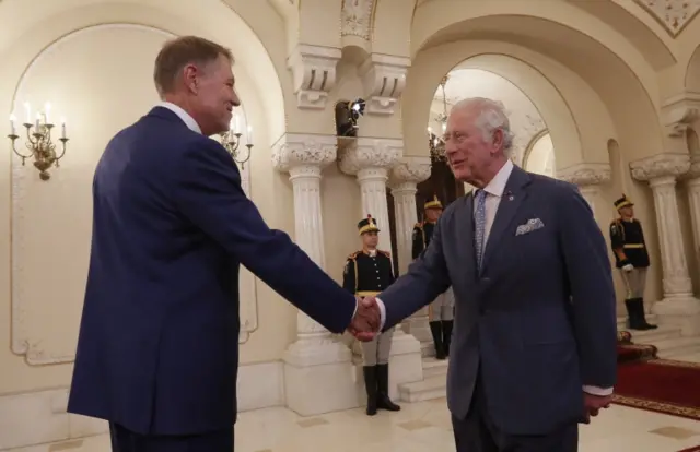 Romanian President Klaus Iohannis welcomes Britain's Prince Charles