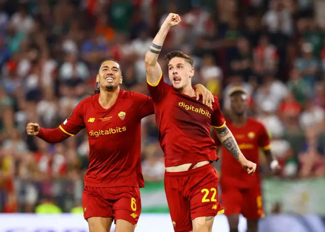 AS Roma's Nicolo Zaniolo celebrates scoring their first goal with Chris Smalling