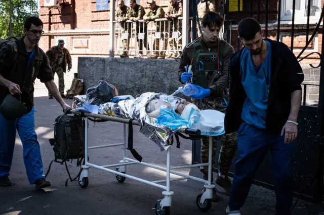 An injured Ukrainian soldier is seen outside a hospital in Bakhmut. The Donetsk (Donbas) region is under heavy attack as Russian forces concentrate their operations in the eastern part of Ukraine.