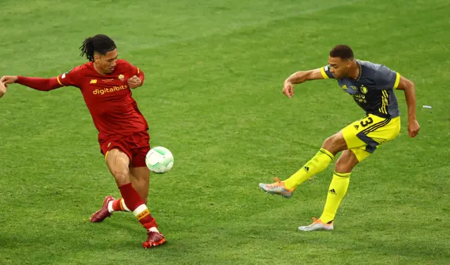 Feyenoord's Cyriel Dessers in action with AS Roma's Chris Smalling