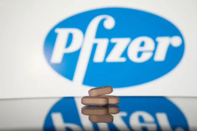 Stock image of pfizer logo and drugs