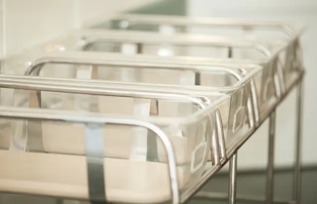 Empty cribs in a hospital