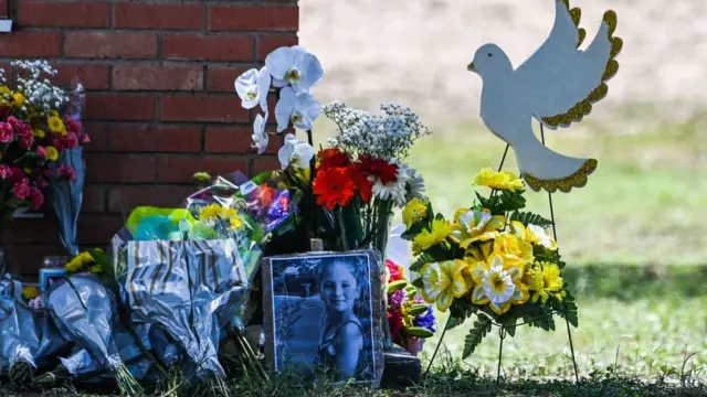 A makeshift memorial has formed outside the school