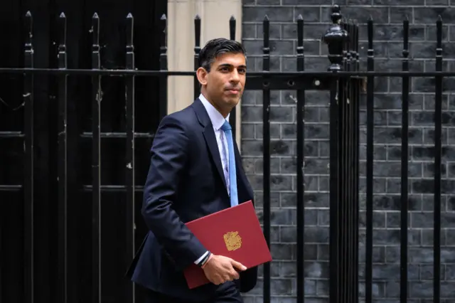 Rishi Sunak walks down Downing Street on Thursday