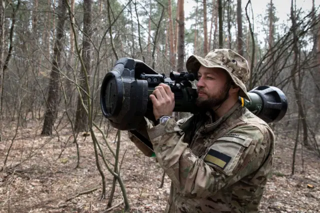 A Ukrainian serviceman operating an anti-tank weapon