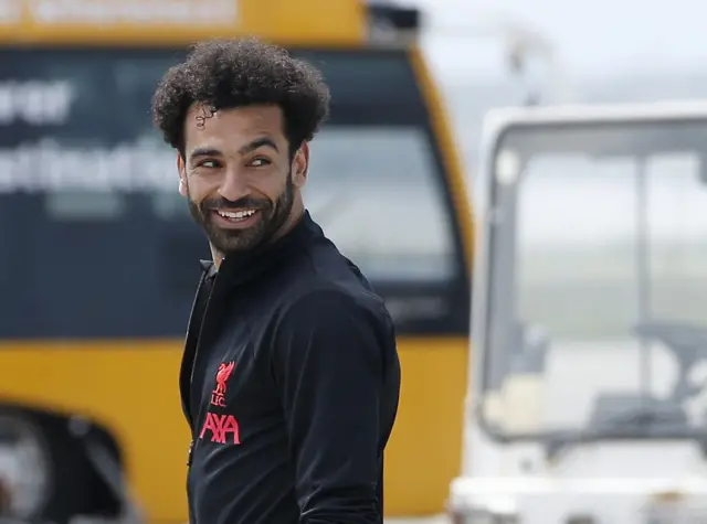 Mohamed Salah boarding the plane