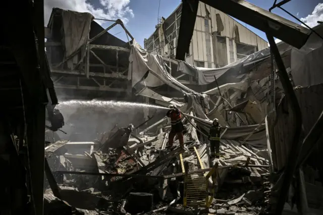 Image shows fireman extinguishing blaze