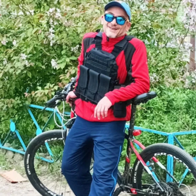 Arif Bagirov poses beside his bike