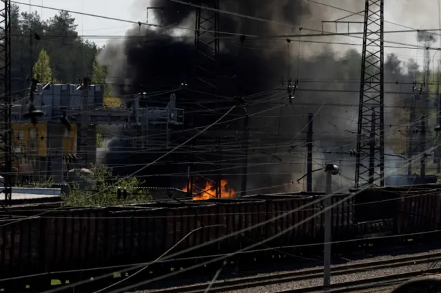 Smoke rises following a military strike on a facility near Lyman railway station