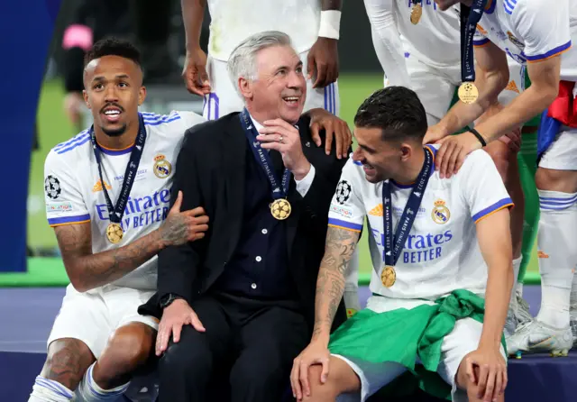 Carlo Ancelotti celebrates with his Real Madrid players after winning the Champions League