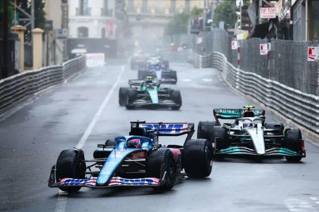 Fernando Alonso in front of Lewis Hamilton