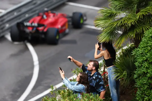 Fans take photos of ferrari