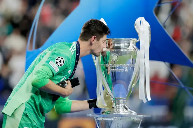 Thibaut Courtois kisses the Champions League trophy after Real Madrid beat Liverpool